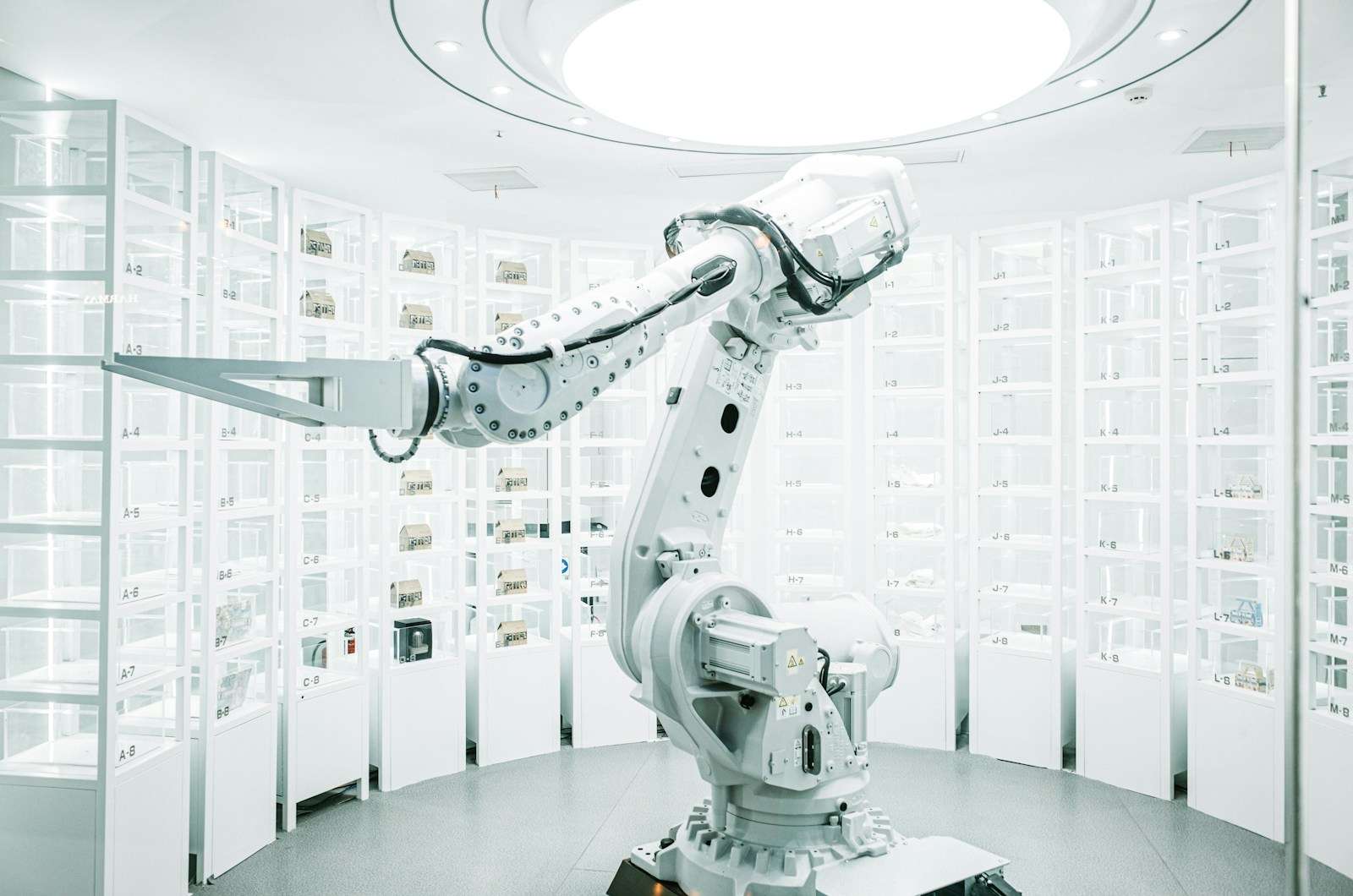 white robotic arm in display showroom